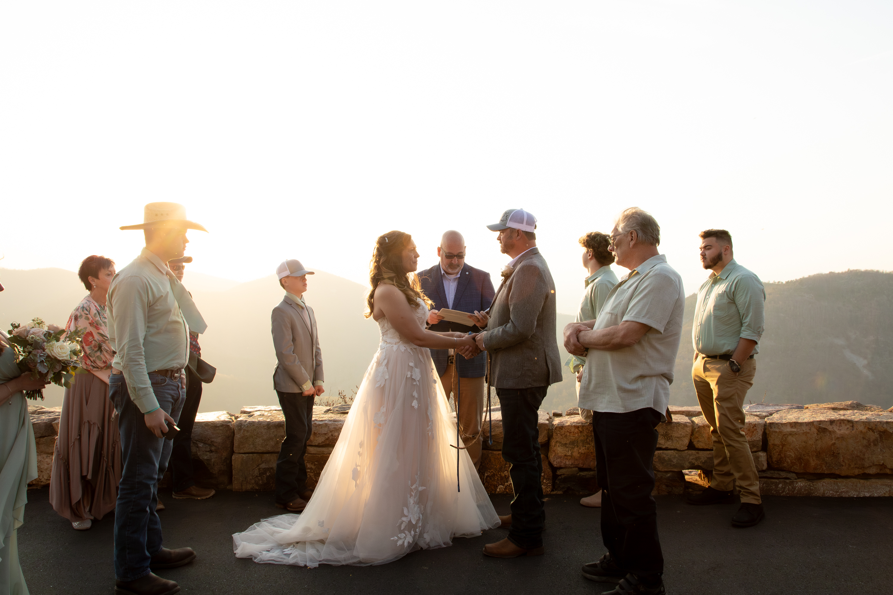 Intimate elopement ceremony at a Shenandoah National Park overlook at golden hour with family gathered
