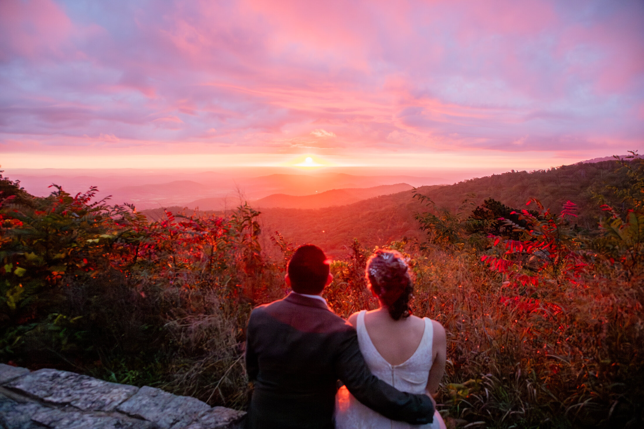 Couple embracing at sunrise in Shenandoah National Park during their elopement